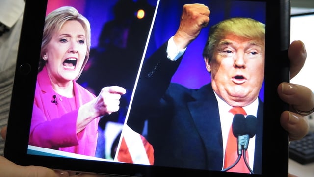 Bildmontage: Hillary Clinton und Donald Trump auf einem Bildschirm. Bildmontage: Hillary Clinton und Donald Trump auf einem Bildschirm.