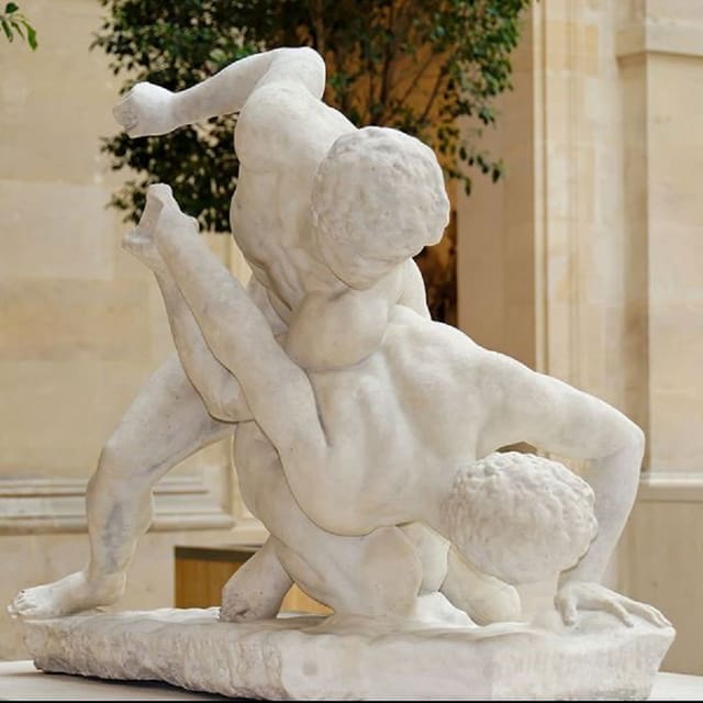 Sculputra che mussa dus sportists vid il lutgar en il temp dals gieus olimpics da l'antica. Sculputra che mussa dus sportists vid il lutgar en il temp dals gieus olimpics da l'antica.