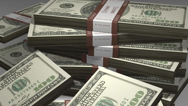 Symbolbild: Dollar-Geldbündel. Symbolbild: Dollar-Geldbündel.