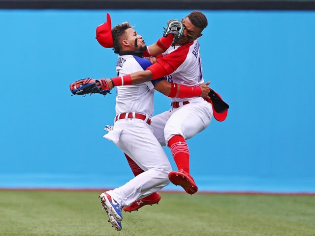 Tokyo 2020 Olympics - Baseball - Men - Opening Round - Group A - Mexico v Dominican Republic - Yokohama Baseball Stadium, Yokohama, Japan - July 30, 2021. Gustavo Nunez of the Dominican Republic and Julio Rodriguez of the Dominican Republic collide as they catch a ball.