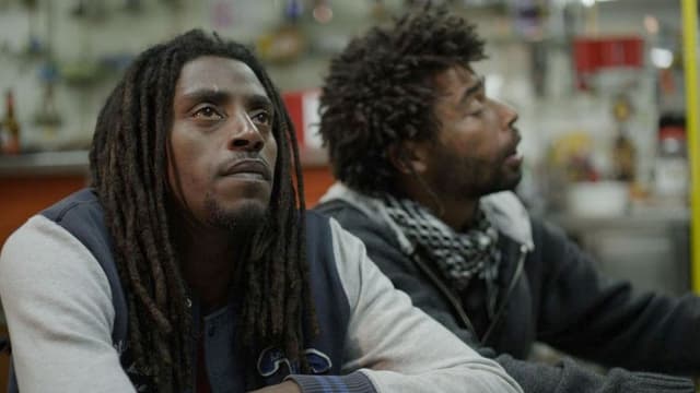 Zwei Männer mit Rastas. Zwei Männer mit Rastas.