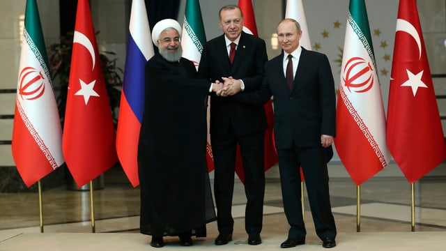 Hassan Rohani (links), Recep Tayyip Erdogan (Bildmitte) und Wladimir Putin (rechts). Hassan Rohani (links), Recep Tayyip Erdogan (Bildmitte) und Wladimir Putin (rechts).