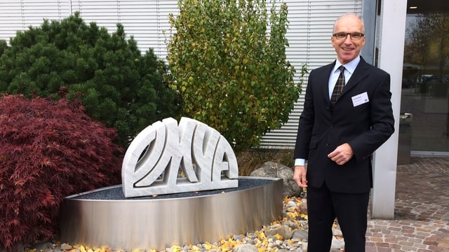 Mann und Omya-Logo Mann und Omya-Logo