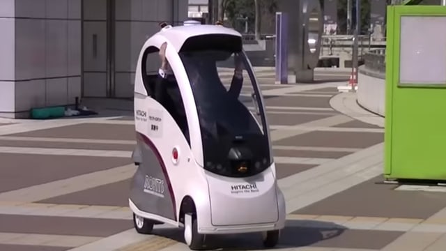 Ein Ein-Mann-Auto in einem Vorführvideo. Ein Ein-Mann-Auto in einem Vorführvideo.