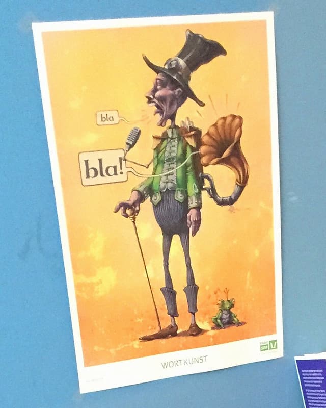 Poster mit Cartoon eines Manns mit Hut, daneben ein Froschkönig Poster mit Cartoon eines Manns mit Hut, daneben ein Froschkönig