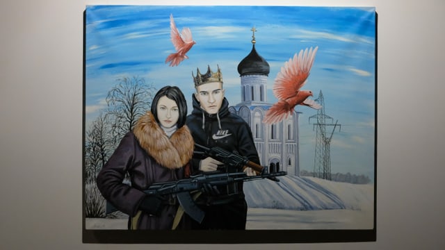 Das Bild eines Paars mit Kalaschnikows. Das Bild eines Paars mit Kalaschnikows.