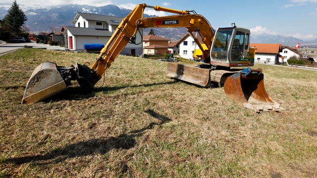 Bagger auf Feld Bagger auf Feld