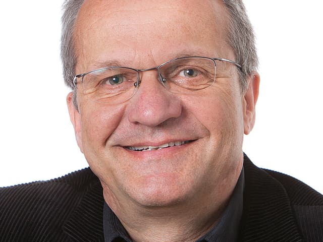 Porträtfoto von Peter Lienhard. Porträtfoto von Peter Lienhard.