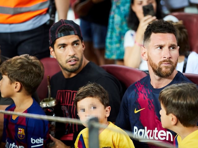 Die verletzten Luis Suarez und Lionel Messi