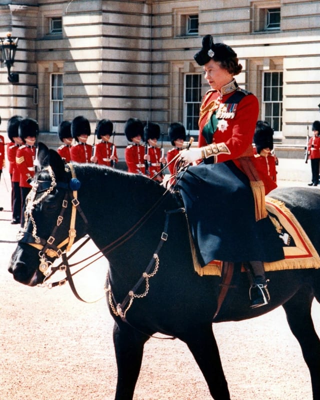 Woman in uniform on horseback
