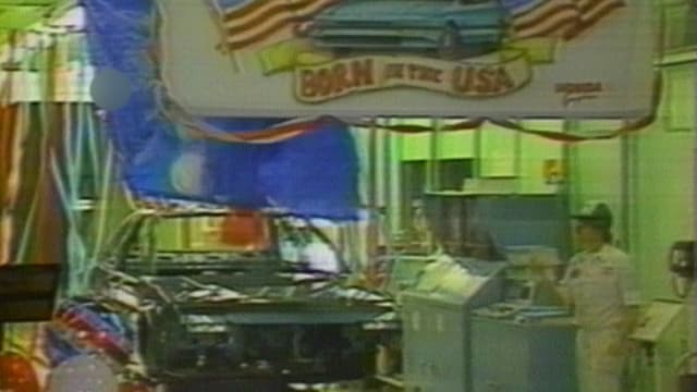 Autofabrick mit Schild «Born in the USA» Autofabrick mit Schild «Born in the USA»