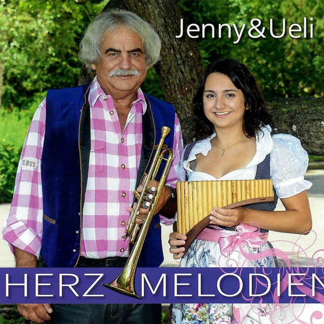 Ein Vater mit einer Trompete und seine Tochter mit einer Panflöte auf dem Cover einer CD. Ein Vater mit einer Trompete und seine Tochter mit einer Panflöte auf dem Cover einer CD.