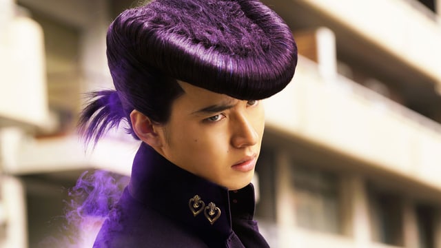 Ein junger Japaner mit exzentrischer Elvis-Tolle. Ein junger Japaner mit exzentrischer Elvis-Tolle.
