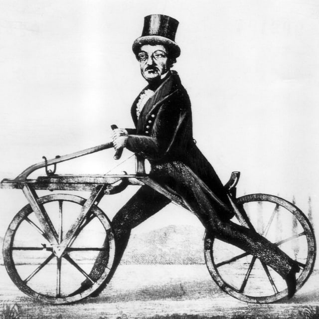 Der Geburtstag des Fahrrads: Carl von Drais auf seiner «Draisine». Der Geburtstag des Fahrrads: Carl von Drais auf seiner «Draisine».