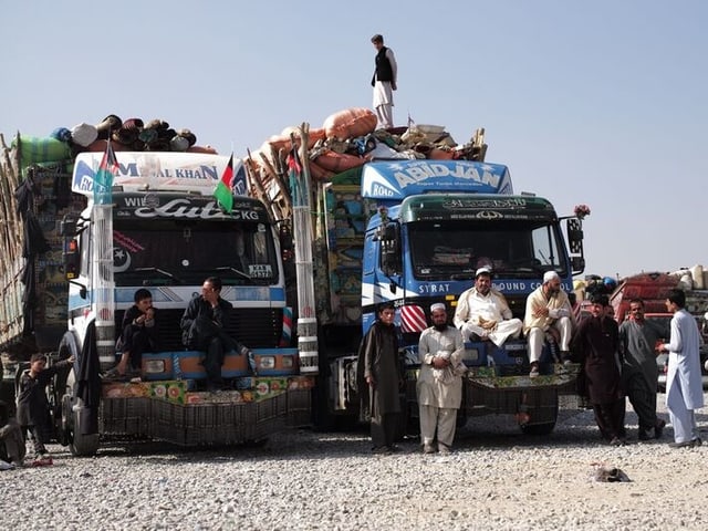 Flüchtlinge auf Lastwagen Flüchtlinge auf Lastwagen