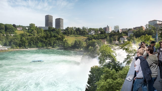 Touristen Blicken auf Rheinfall mit Hochhäusern im Hintergrund. Touristen Blicken auf Rheinfall mit Hochhäusern im Hintergrund.