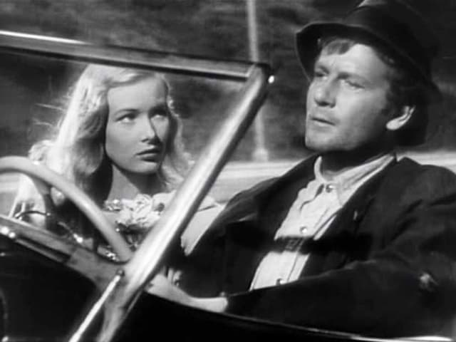 Joel Mccrea als Strandstreicher in einem Auto mit Veronia Lake. Joel Mccrea als Strandstreicher in einem Auto mit Veronia Lake.