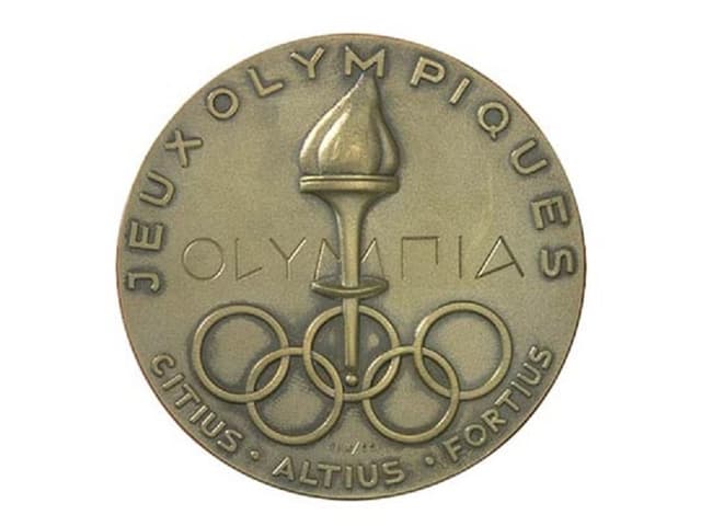 Medaglia dals gieus olimpics 1952 ad Oslo cun ils motto olimpic. Medaglia dals gieus olimpics 1952 ad Oslo cun ils motto olimpic.