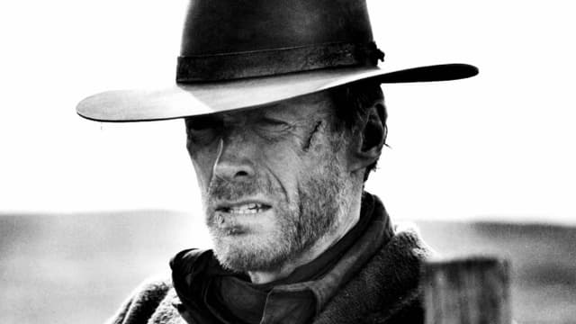 Ein Mann mit Cowboyhut und Narbe Ein Mann mit Cowboyhut und Narbe