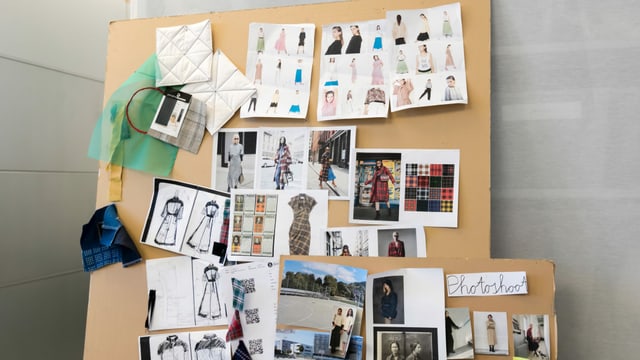 Eine Wand mit Fotos von Kreationen von Sabine Portenier. Eine Wand mit Fotos von Kreationen von Sabine Portenier.