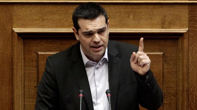 Tsipras im Porträt am Rednerpult im Athener Parlament. Tsipras im Porträt am Rednerpult im Athener Parlament.
