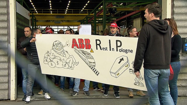Protestierende Arbeiter mit einem Transparent. Protestierende Arbeiter mit einem Transparent.