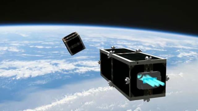 Illustration der Clean Space One, die den Schrott im Orbit einsammeln soll. Illustration der Clean Space One, die den Schrott im Orbit einsammeln soll.