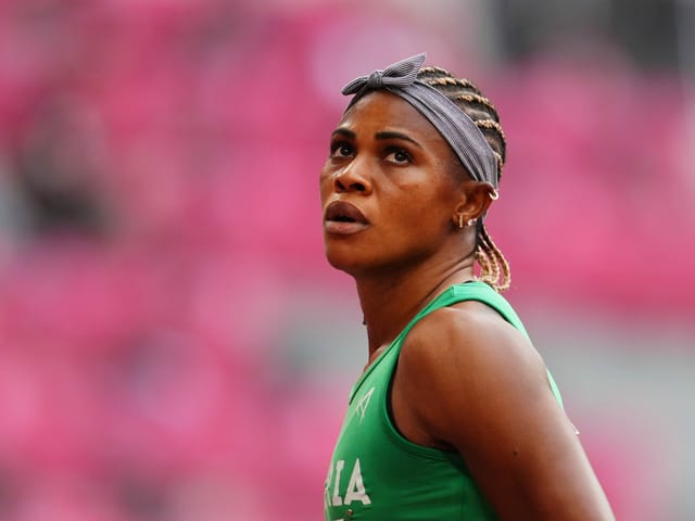 Sprinterin Blessing Okagbare in grünem Renndress. Sprinterin Blessing Okagbare in grünem Renndress.