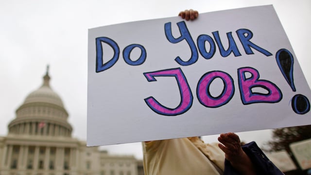 «Macht euren Job», steht auf dem Schild. «Macht euren Job», steht auf dem Schild.