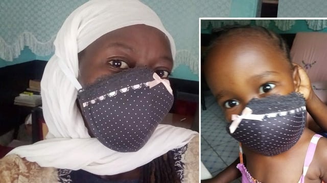 Eine Frau und ein Kind mit Masken. Eine Frau und ein Kind mit Masken.