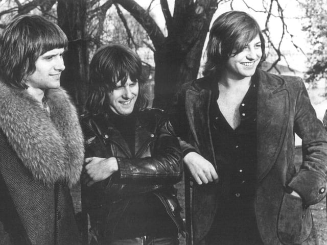 Die Band ELP mit Mäntel und Lederjacken und langen Haaren. Die Band ELP mit Mäntel und Lederjacken und langen Haaren.