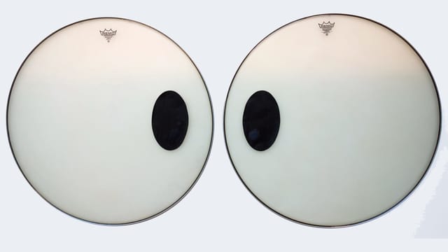 Zwei Trommelfelle mit aufgemalten, comichaften Augen. Zwei Trommelfelle mit aufgemalten, comichaften Augen.