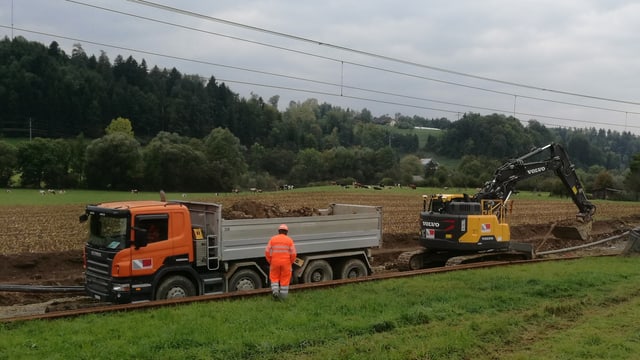 Bagger und Lastwagen Bagger und Lastwagen