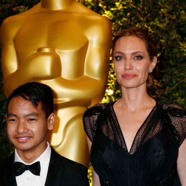 Maddox, Angelina Jolie, Brad Pitt Maddox, Angelina Jolie, Brad Pitt