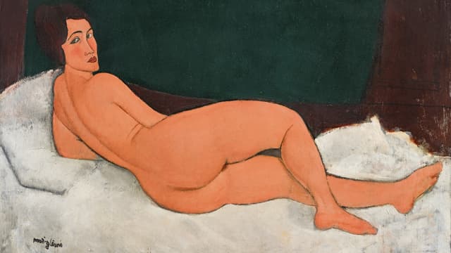 Nackte Frau, auf einem Bett liegend Nackte Frau, auf einem Bett liegend