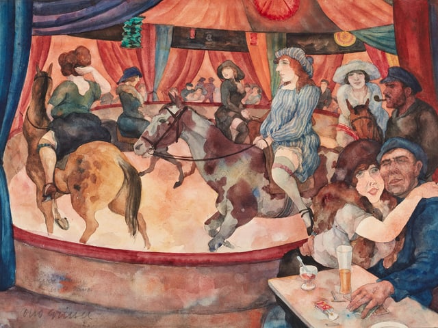 Eine Manege, in der Leute Pferde reiten. Eine Manege, in der Leute Pferde reiten.