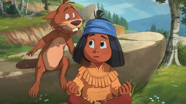 ein junger indigener Bub redet mit einem Biber ein junger indigener Bub redet mit einem Biber