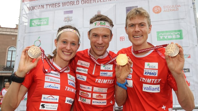 Judith Wyder (3.), Daniel Hubmann (Weltmeister) und Andreas Kyburz (3.) präsentieren ihre Medaillen. Judith Wyder (3.), Daniel Hubmann (Weltmeister) und Andreas Kyburz (3.) präsentieren ihre Medaillen.