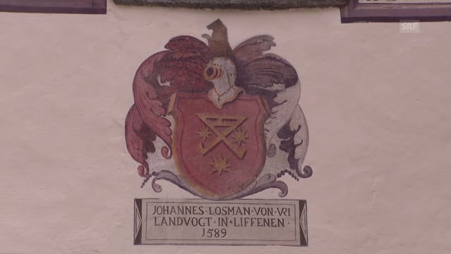 Farbige Zeichnung des Urner Wappens an einer Hausmauer Farbige Zeichnung des Urner Wappens an einer Hausmauer