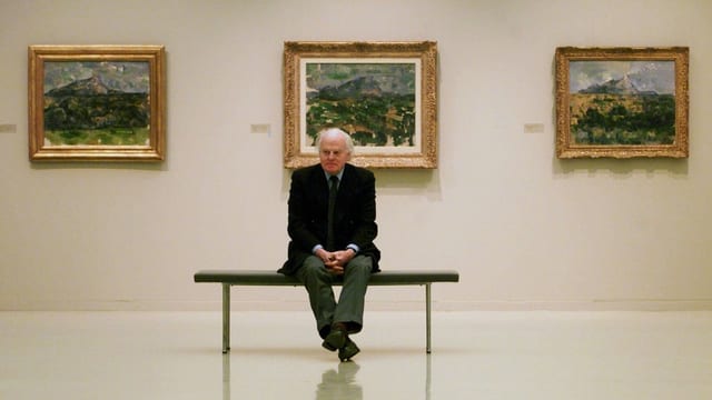Eberhard Kornfeld sitzt in einem Museum vor drei Cezanne-Bildern. Eberhard Kornfeld sitzt in einem Museum vor drei Cezanne-Bildern.