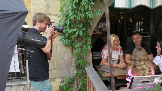 Fotograf bei der Arbeit Fotograf bei der Arbeit