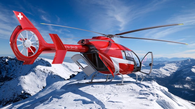 Ein roter Marenco-Helikopter auf einem schneebedeckten Berg. Ein roter Marenco-Helikopter auf einem schneebedeckten Berg.