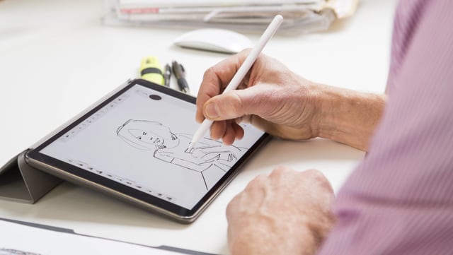 Ein Grafiker bei der Arbeit Ein Grafiker bei der Arbeit