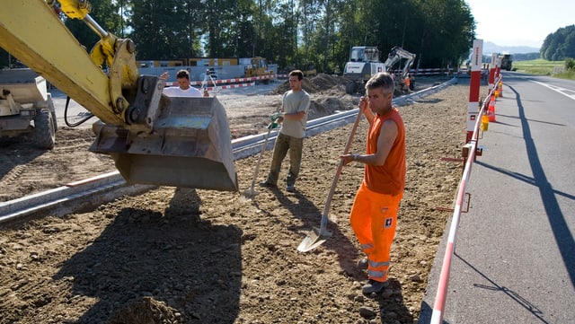 Strassenbauer bei der Arbeit Strassenbauer bei der Arbeit