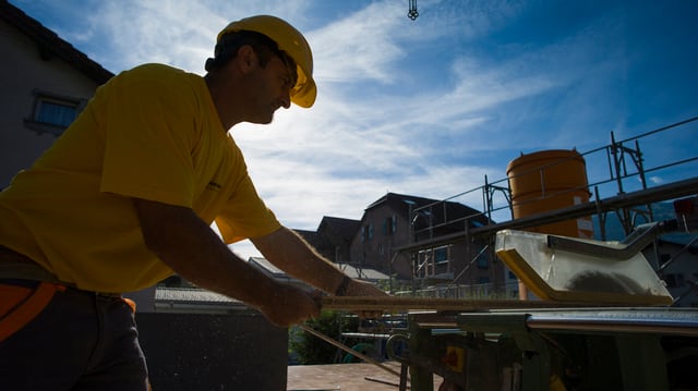 Bauarbeiter auf einer Baustelle Bauarbeiter auf einer Baustelle