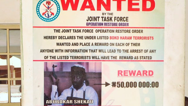 Ein Plakat zur Verhaftung des Boko Haram-Anführers. Ein Plakat zur Verhaftung des Boko Haram-Anführers.