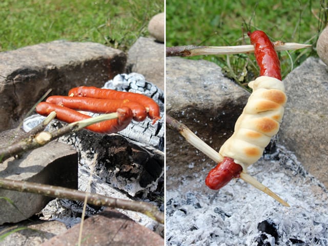 Schweinswürstli im Teig über dem Feuer. Schweinswürstli im Teig über dem Feuer.