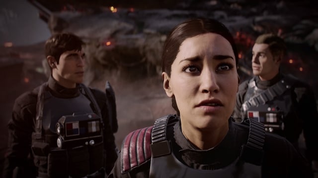 Iden Versio steht vor einem Trümmerfeld. Hinter ihr, ihre beiden Gefährten. Iden Versio steht vor einem Trümmerfeld. Hinter ihr, ihre beiden Gefährten.