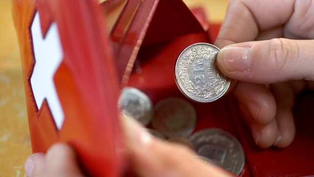 Ein Portemonnaie mit Kleingeld Ein Portemonnaie mit Kleingeld