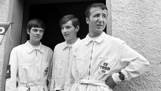 Drei Männer in weissen Overalls Drei Männer in weissen Overalls